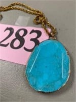 FACITED TURQUOIS COLORED PENDANT ON OLD TONE
