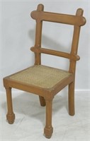 Cane seat carved chair