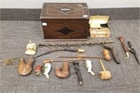 Antique wooden cigar humidor with pipes, tobacco,