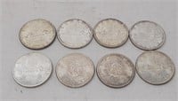 8 Canadian $1 coins. 1961-1964