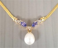 14K gold necklace set with diamonds, tanzanite &