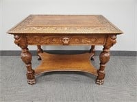 Antique carved oak library table with claw feet