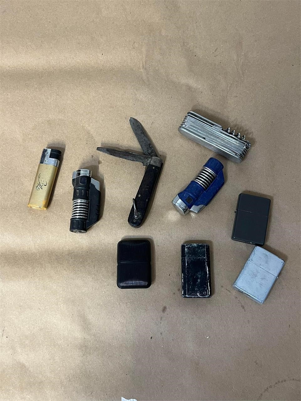 LOT DEAL OF KNIVES, LIGHTERS ETC SEE PICTURES