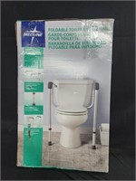 Foldable toilet safety rail