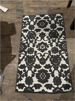 Brown and cream rug