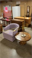 Upholstered swivel chair, end table, floor light