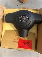 Genuine Toyota steering wheel cover and air bag.