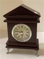 Small footed battery operated quartz movement