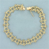 Double Loop and Bead Charm Bracelet in 14k Yellow