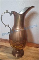 Antique copper pitcher.