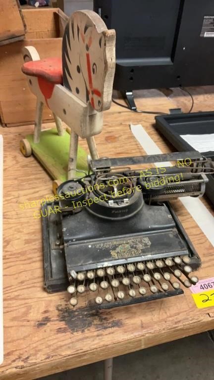 Vintage typewriter, wooden horse