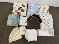 Large group textiles, patchwork quilts, table