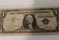 1957 $1 Silver certificate with a protective case