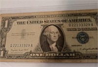 1957A $1 Silver certificate with a protective