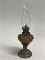 Oil lamp measuring 10 inches inches tall as shown
