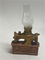 oil lamp/sewing machine measuring 8 inches tall