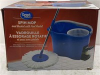 Spin mop and bucket with foot pedal