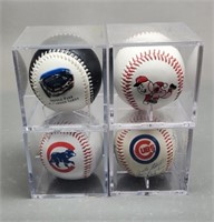 4 Baseballs in Plastic Cases