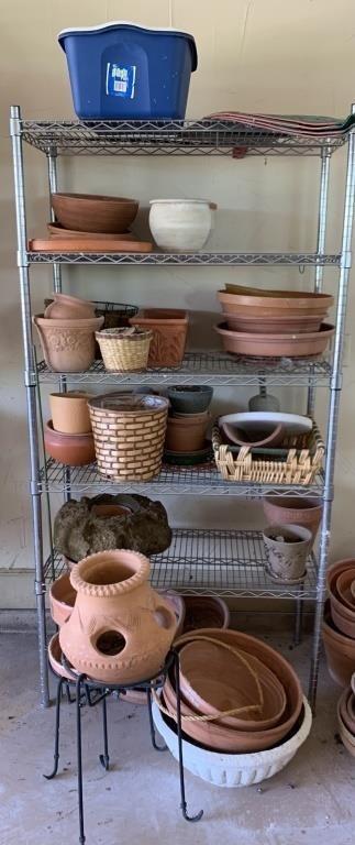 A Metal Shelf With Various Pots & Planters