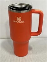 Orange Stanley 40 oz tumbler cup no lid