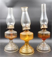 TRIO OF PRESSED GLASS OIL LAMPS W CHIMNEYS