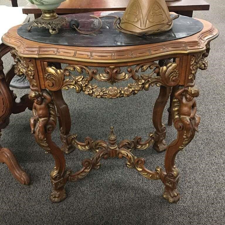 Black Marble Top Table With Cherub Carved Base