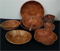 Assorted vintage wooden salad bowls and a spoon