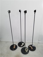 Four small Sony surround sound speakers