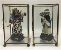 Pair Of Oriental Figures In Display Cases