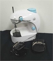 Mini sewing machine with foot pedal and power
