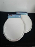 Two new round Wood toilet seats