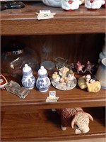 Shelf contents ceramic Jars mugs trinkets and