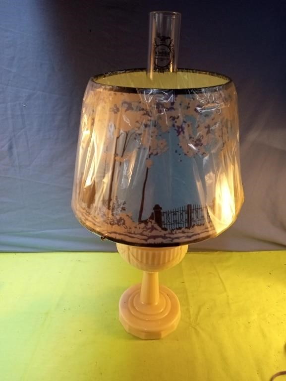 Vintage Aladdin hurricane oil lamp with a pinkish