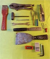 Lot of tools including scrapers, staples,