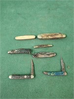 Pocket knives, some are rusted shut
