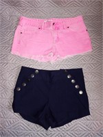 Size 4 pink brand pink shorts. Blue shorts say