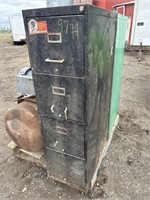 Black metal filing cabinet with contents