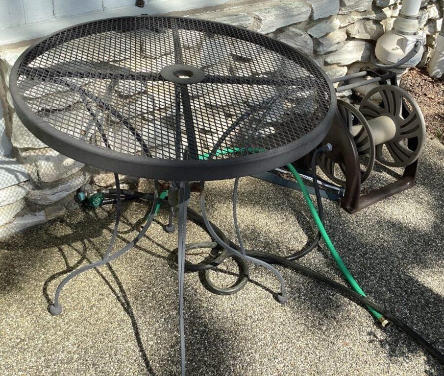 Tall bistro patio table and hose reel