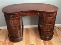 Kidney-shaped mahogany writing desk