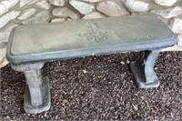 Concrete garden bench with fleur de lis