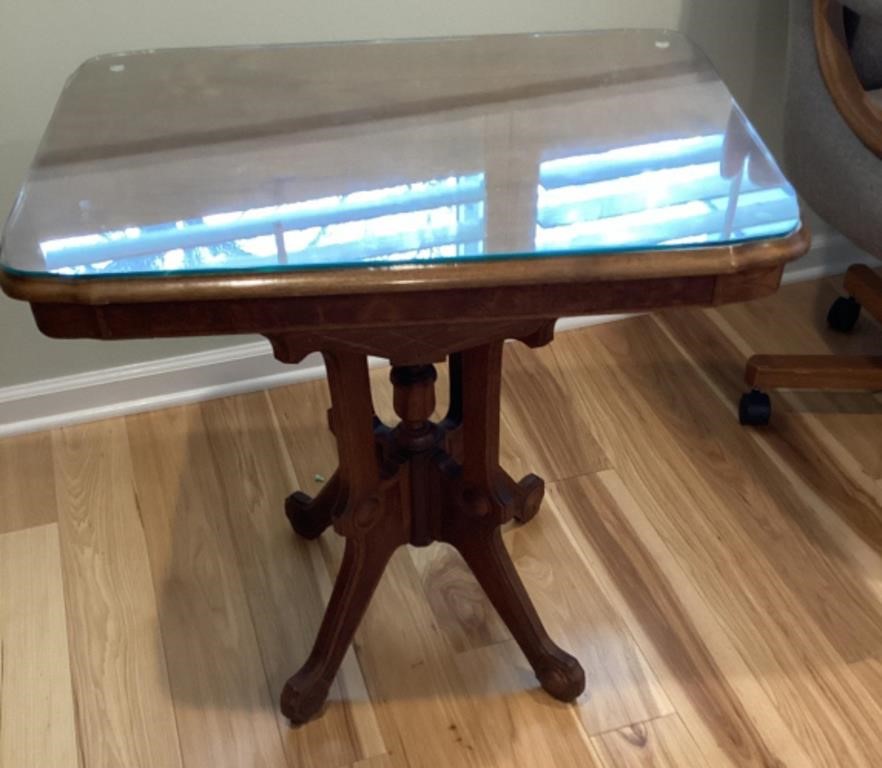 Wooden parlor table with glass top