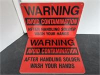 2 plastic warning signs