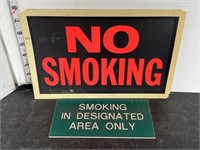 2 plastic no smoking signs