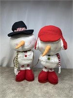 Plush snowman decorations with expandable legs