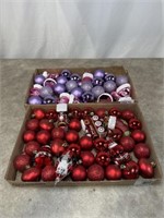 Assortment of red and purple colored ornaments