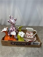 Colorful flower vases, Giraffe bank, and small