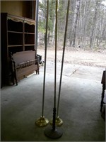 three flag poles, stands