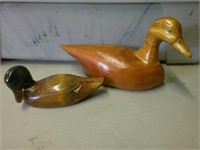 two hand carved ducks