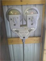 dual parking meter on steel stand