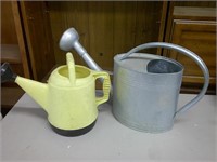 two watering cans